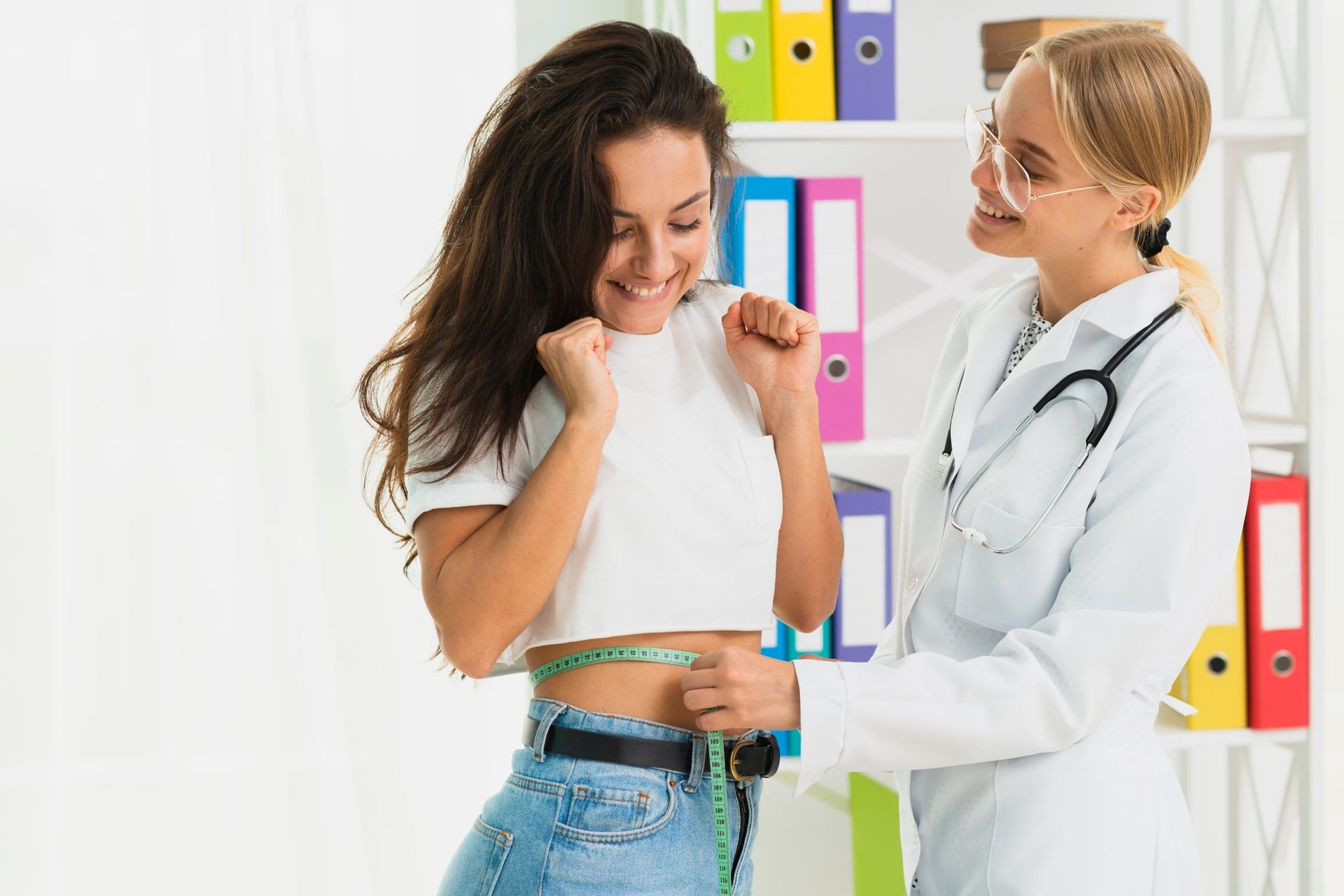 happy patient with doctor during weight loss consultation