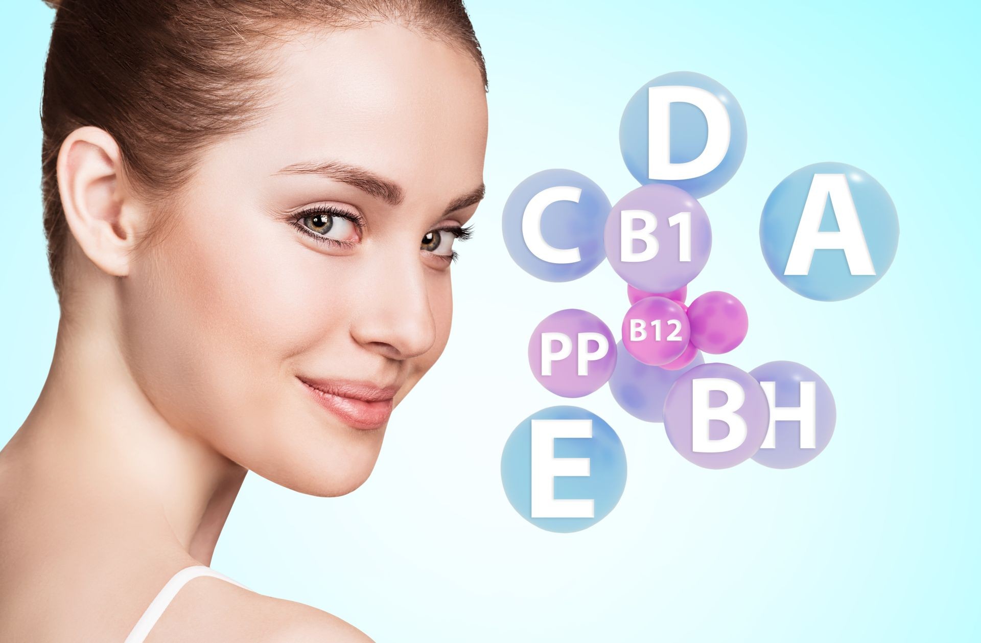 Woman face with vitamins icons. Healthy skin concept. Over blue background.